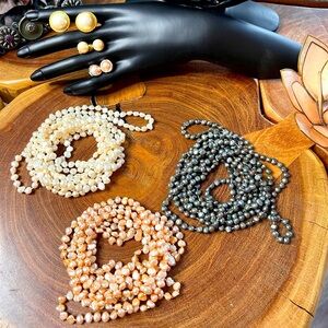 3 strands of baroque, freshwater pearls with three pairs of matching earrings.